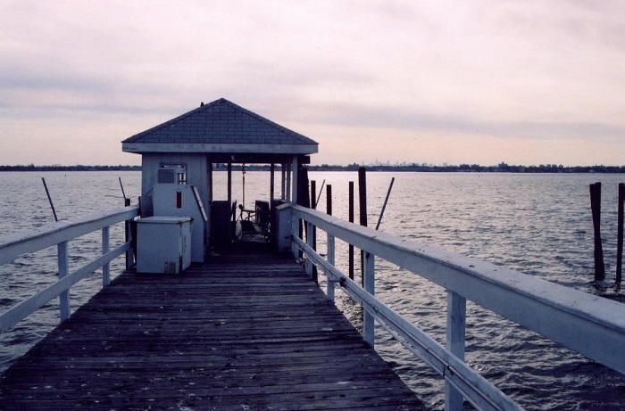 image of dawn rising over a fishing dock